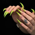 Extra long lime green ombre Dragon Claw press-on nails with nude pink bases and dramatic curved tips, displayed on both hands.